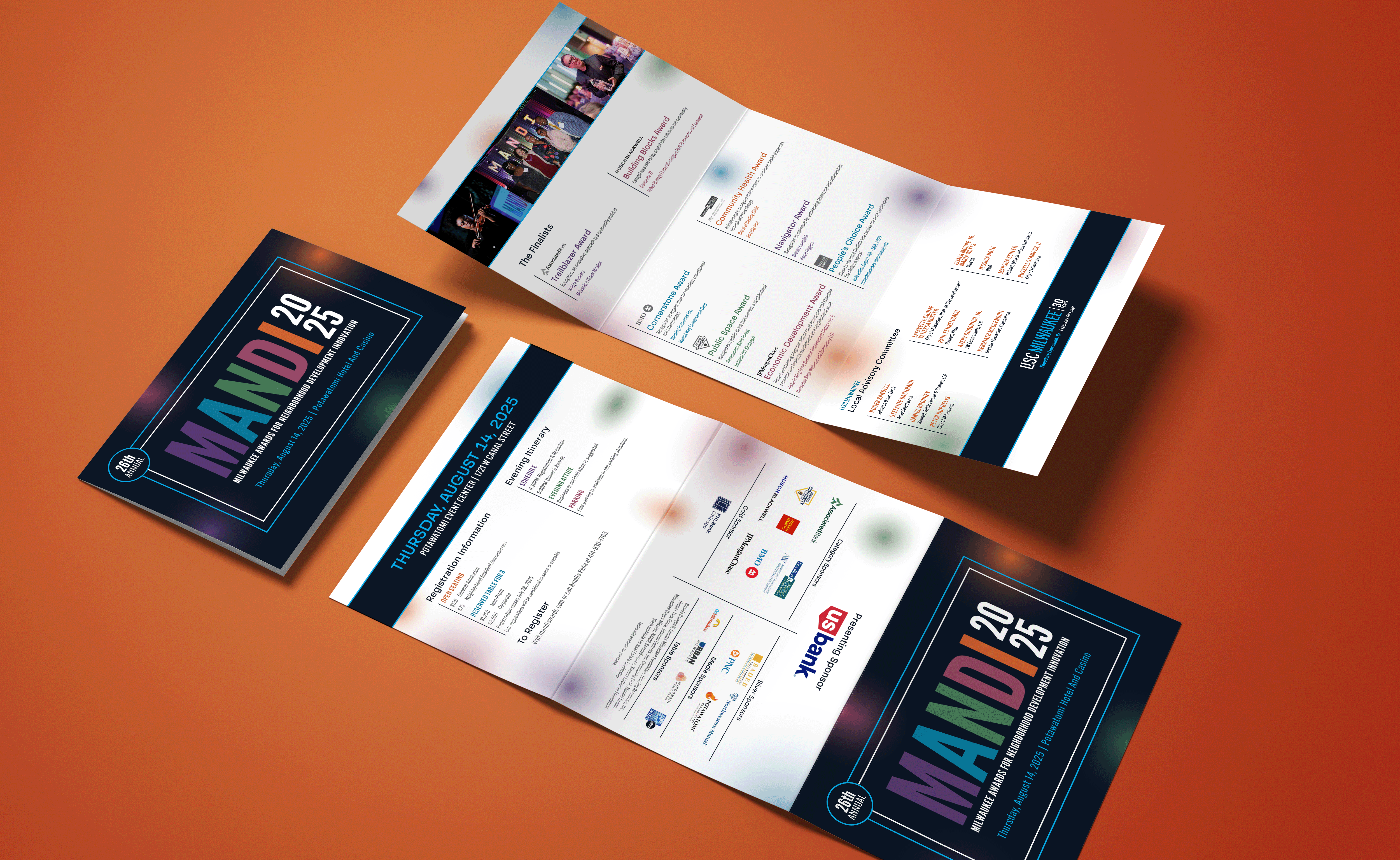 Two colorful event brochures for MANDI 2024-25 lie on an orange surface, showcasing schedules, sponsor logos, and event details in a modern, vibrant design that highlights the brand’s creative strategy and marketing appeal.