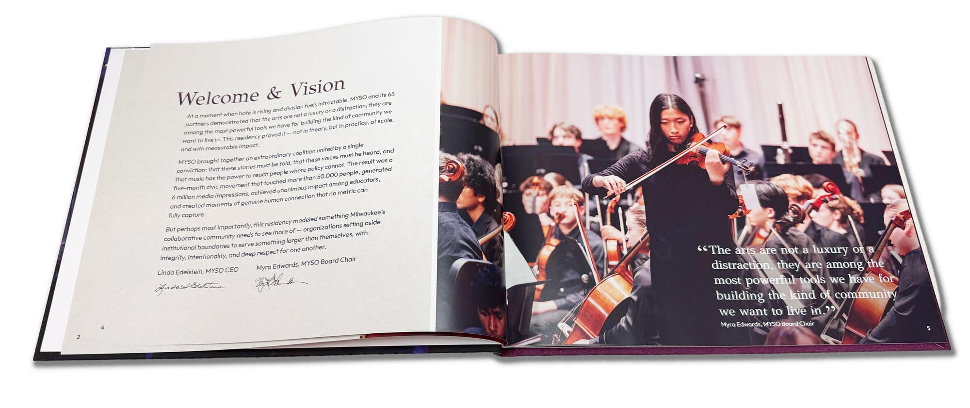 An open book shows a welcome letter on the left page and a photo of a young violinist performing with an orchestra on the right, along with a quote about the importance of the arts.